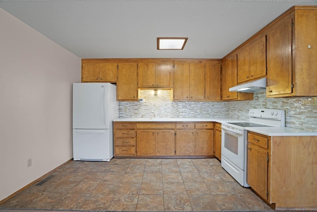 kitchen featuring white appliances, visible vents, decorative backsplash, under cabinet range hood, and brown cabinets