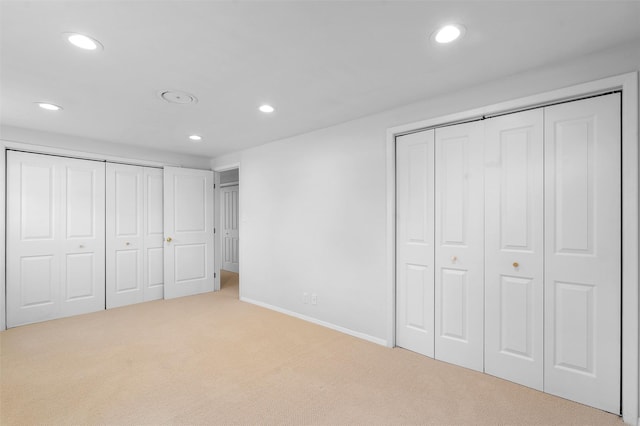 unfurnished bedroom featuring recessed lighting, baseboards, and carpet floors