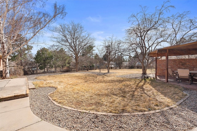 view of yard with a patio and fence