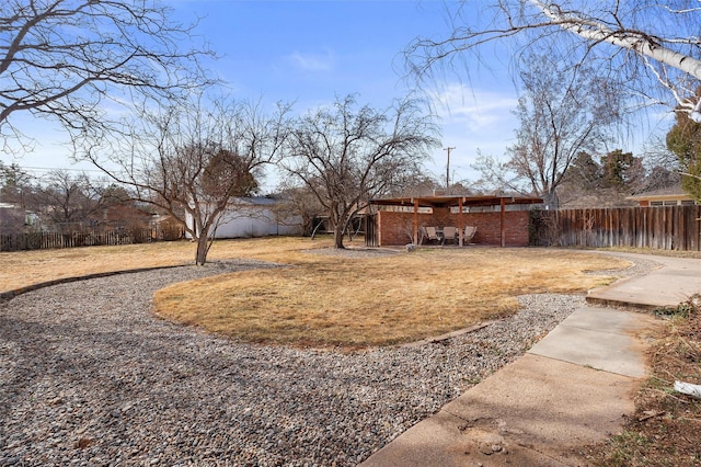 view of yard with a patio area and a fenced backyard