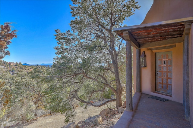 doorway to property with stucco siding