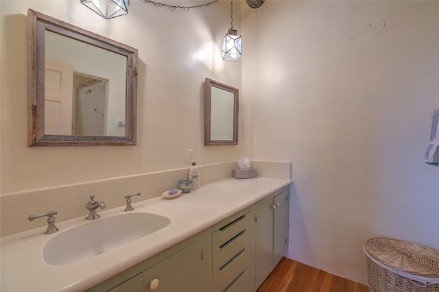 bathroom with vanity and wood finished floors