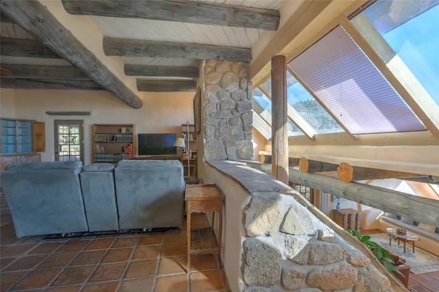 living room featuring tile patterned floors, beamed ceiling, wood ceiling, and a skylight