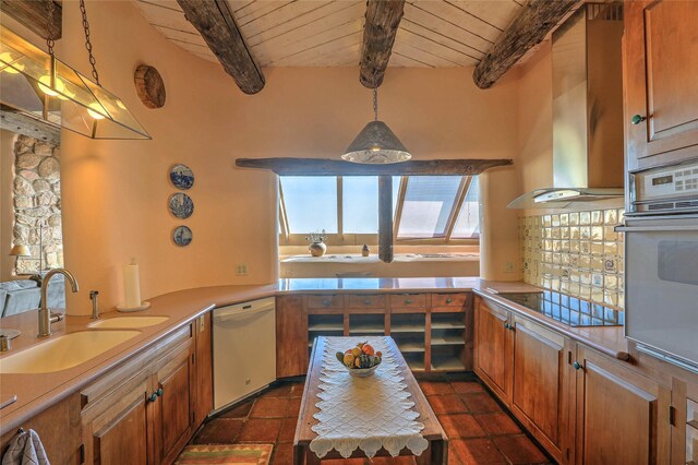 kitchen with white appliances, wall chimney exhaust hood, wood ceiling, and a sink