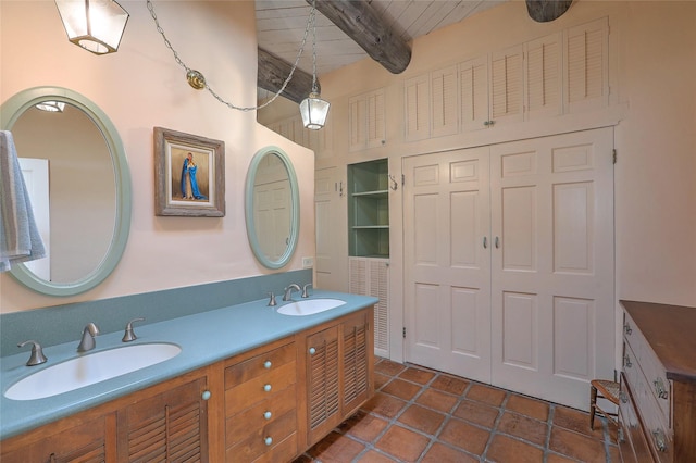 full bath featuring a sink, beam ceiling, wood ceiling, and double vanity