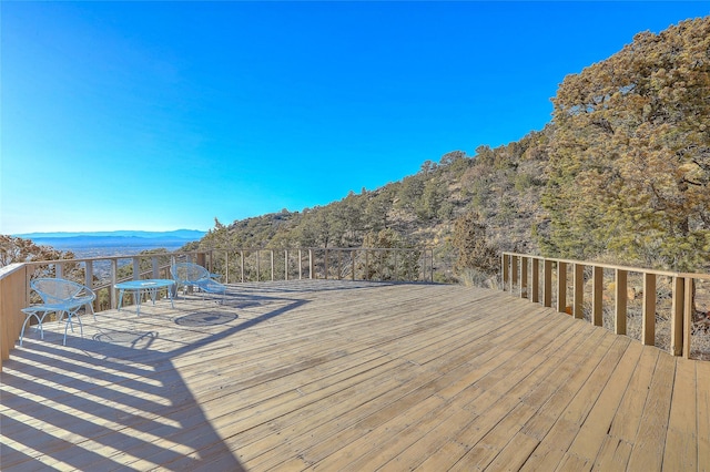 wooden terrace with a mountain view