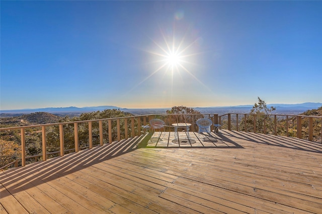 wooden deck featuring a mountain view