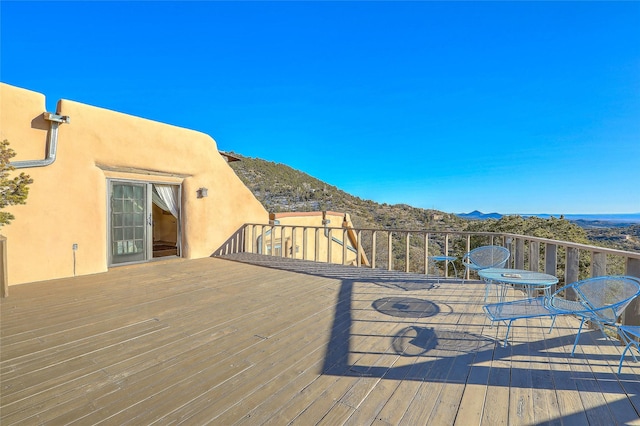 wooden terrace featuring a mountain view