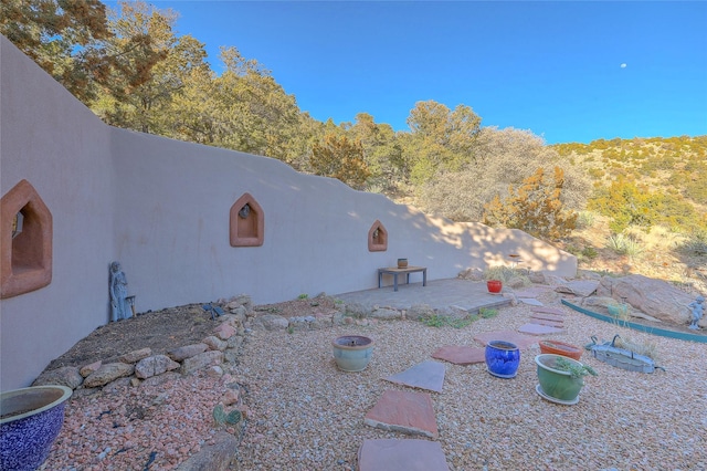 view of home's exterior featuring fence and a patio area