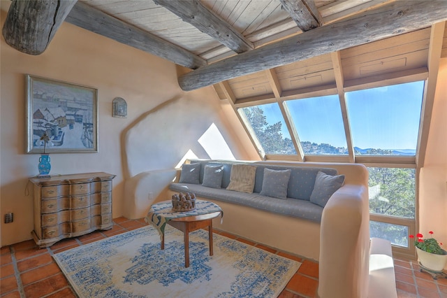 tiled living area with beamed ceiling and wooden ceiling