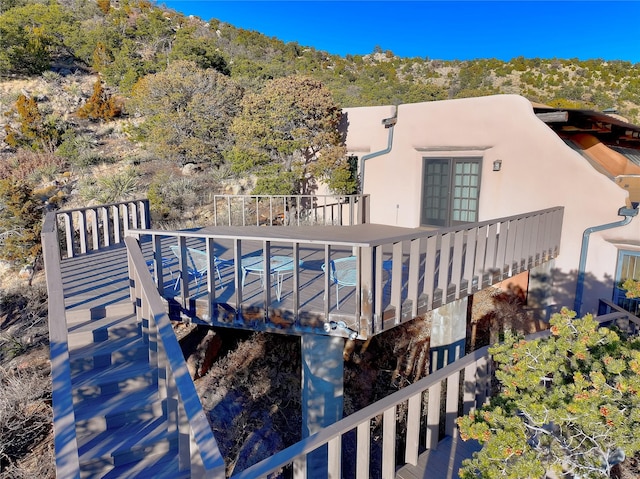 rear view of property with stucco siding