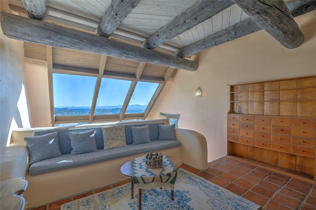 tiled living room featuring wood ceiling, a mountain view, and beamed ceiling