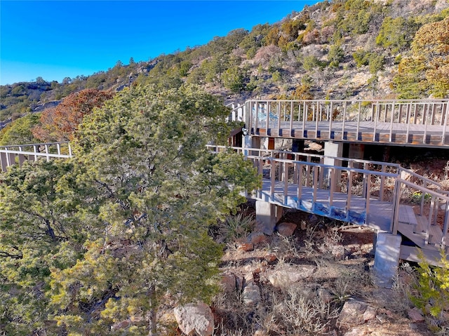 exterior space featuring a forest view