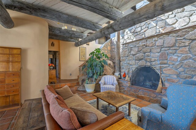 living room with tile patterned floors, beamed ceiling, and wood ceiling