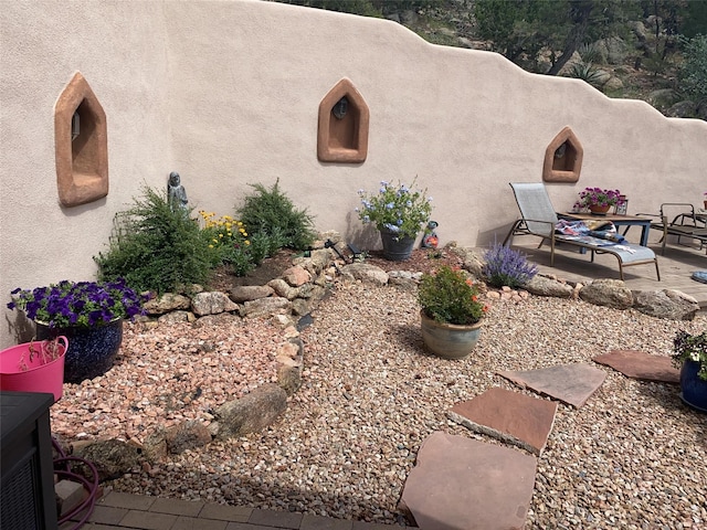 exterior space featuring a patio area and stucco siding