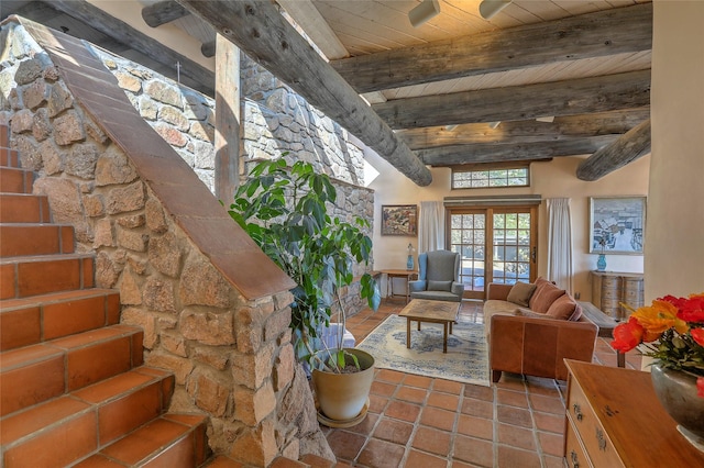 tiled living area with beam ceiling, wood ceiling, and stairs