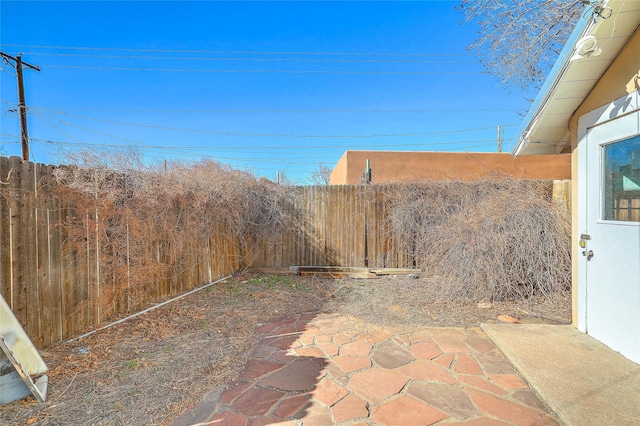 view of yard featuring a patio area and fence