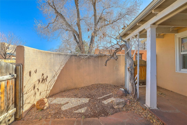 view of yard featuring a gate and fence