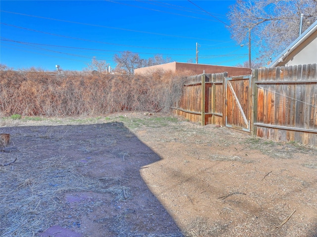 view of yard with a gate and fence