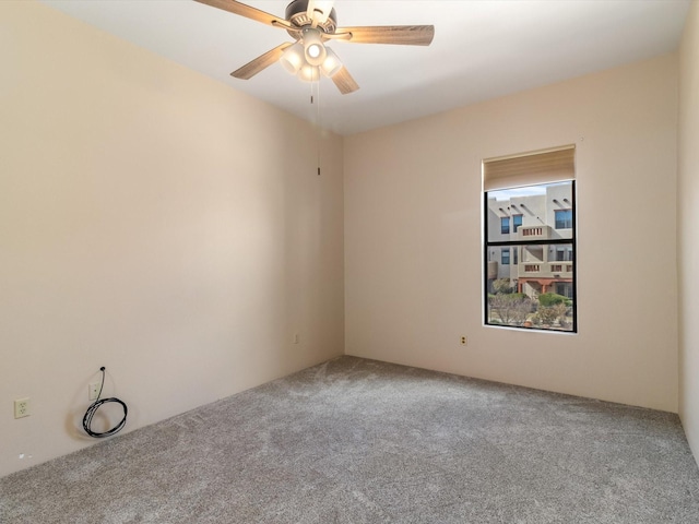 carpeted empty room with ceiling fan