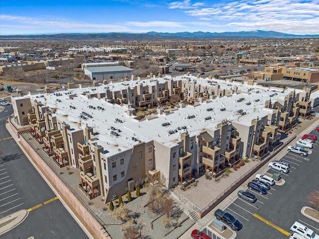 birds eye view of property with a mountain view