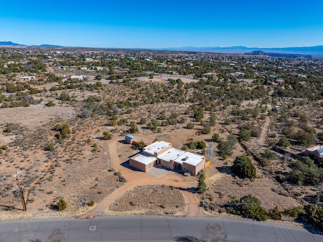 drone / aerial view featuring a mountain view