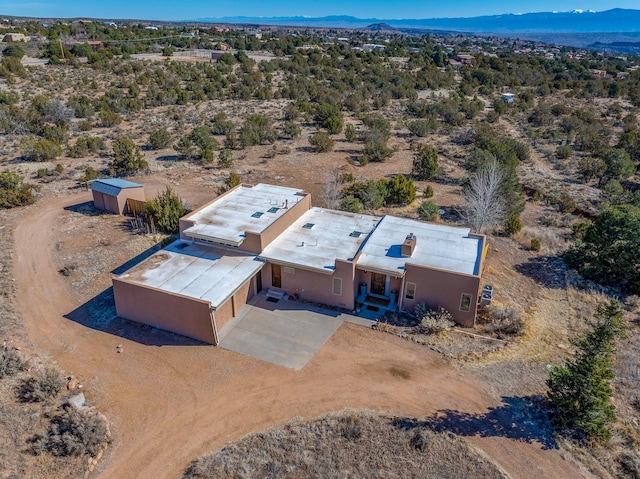 bird's eye view featuring a mountain view and a desert view