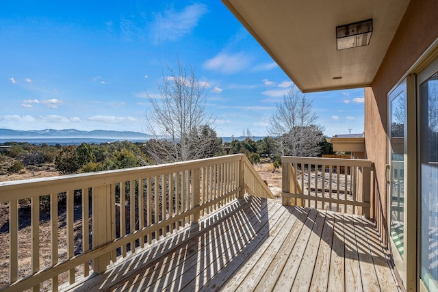 wooden terrace featuring a mountain view