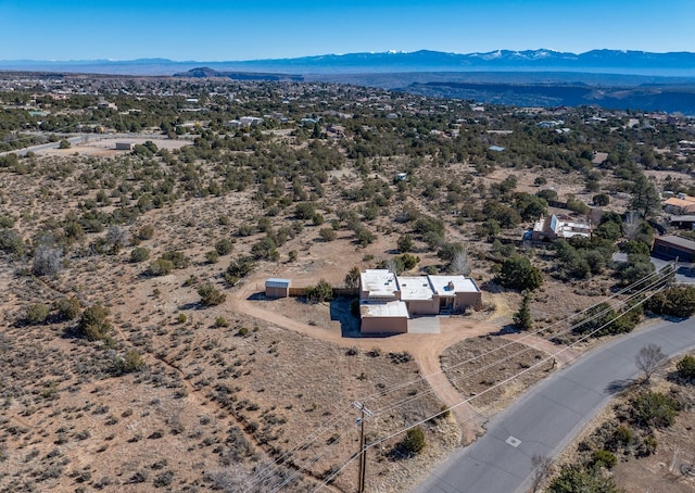 birds eye view of property with a mountain view