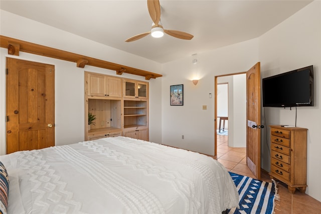 bedroom with light tile patterned floors and ceiling fan