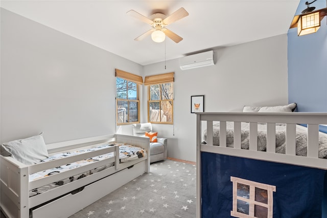 carpeted bedroom with a wall unit AC