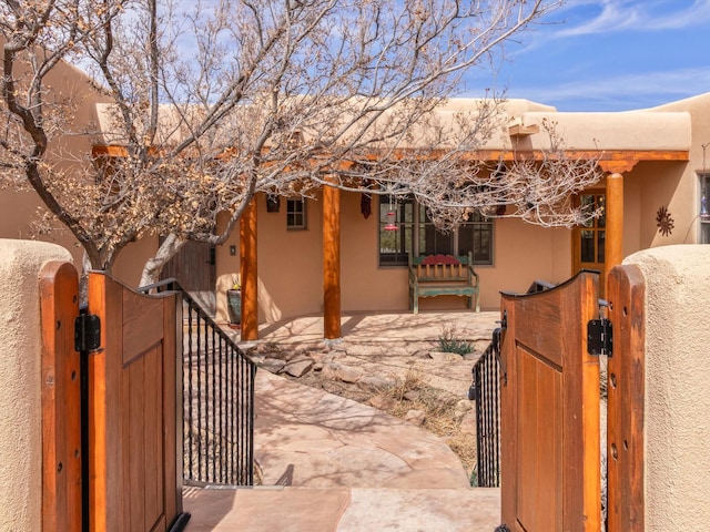 exterior space with a gate and fence