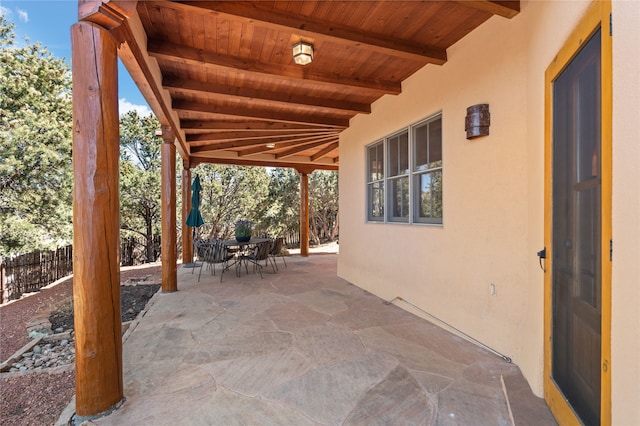 view of patio / terrace featuring outdoor dining space and fence