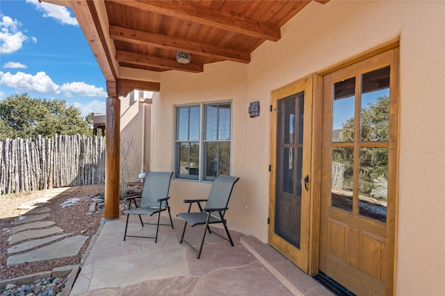 view of patio featuring fence