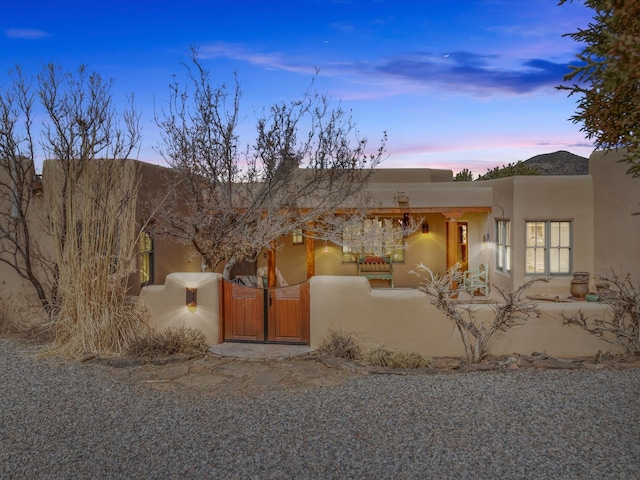 view of front of property featuring a gate and a fenced front yard