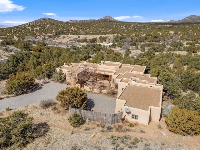 birds eye view of property with a mountain view