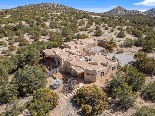 birds eye view of property featuring a mountain view