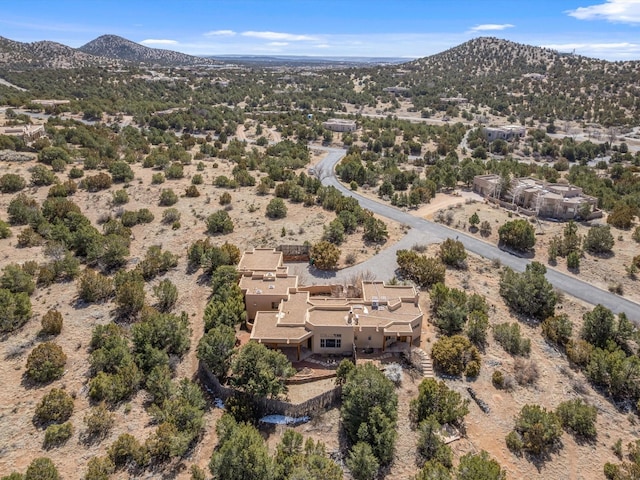 birds eye view of property featuring a mountain view