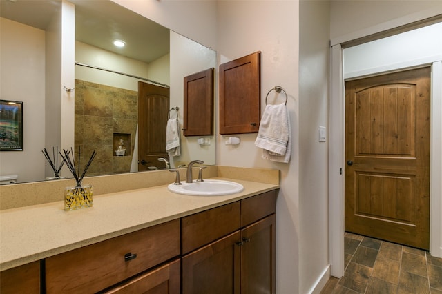 full bath featuring a shower with curtain, toilet, and vanity