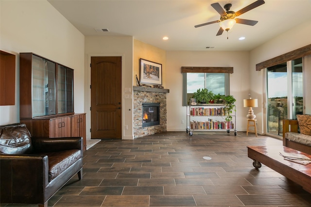 living room with visible vents, plenty of natural light, and a ceiling fan