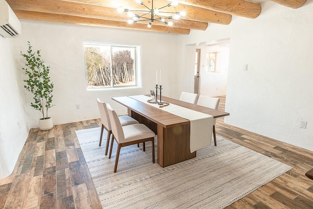 dining area with beamed ceiling, a notable chandelier, an AC wall unit, and light wood finished floors