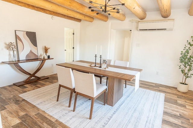 unfurnished dining area with an inviting chandelier, a wall unit AC, beamed ceiling, and wood finished floors