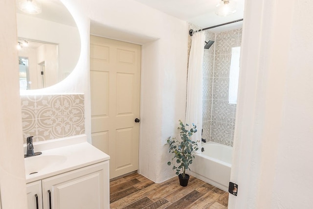 bathroom with vanity, wood finished floors, and shower / bath combo with shower curtain