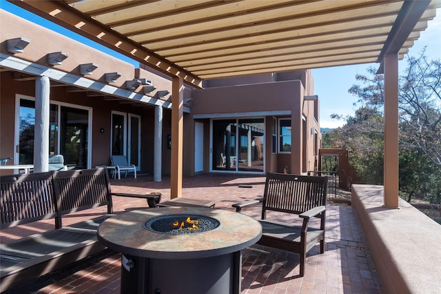 view of patio featuring a fire pit