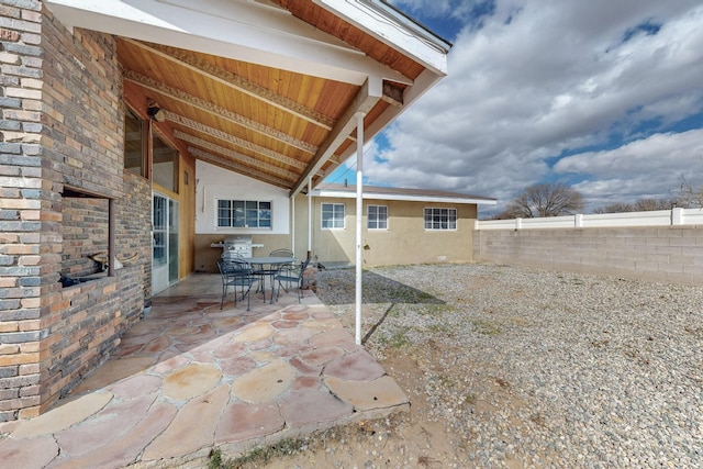 view of patio / terrace featuring outdoor dining space and fence