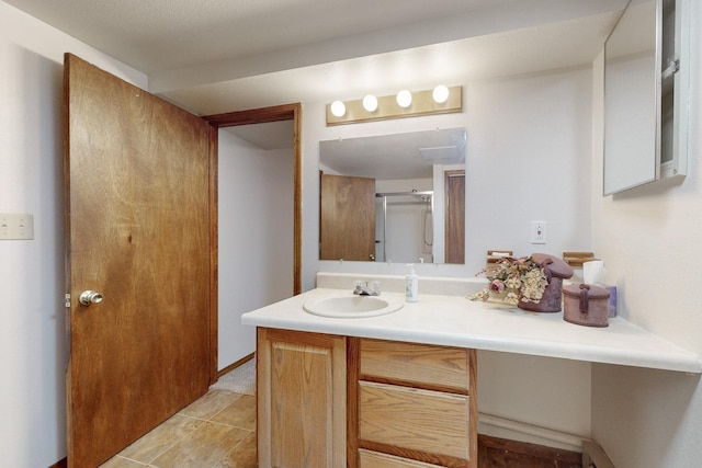 full bathroom featuring vanity and a shower with door