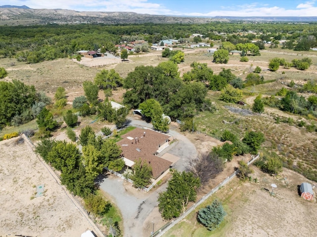 birds eye view of property with a mountain view
