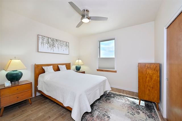 570 Via Arista, Santa Fe, NM 87506 - bedroom with a ceiling fan, wood finished floors, and baseboards