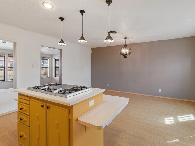 902 Calle Loma, Espanola, NM 87532 - kitchen with a wealth of natural light, visible vents, light wood finished floors, and white gas stovetop
