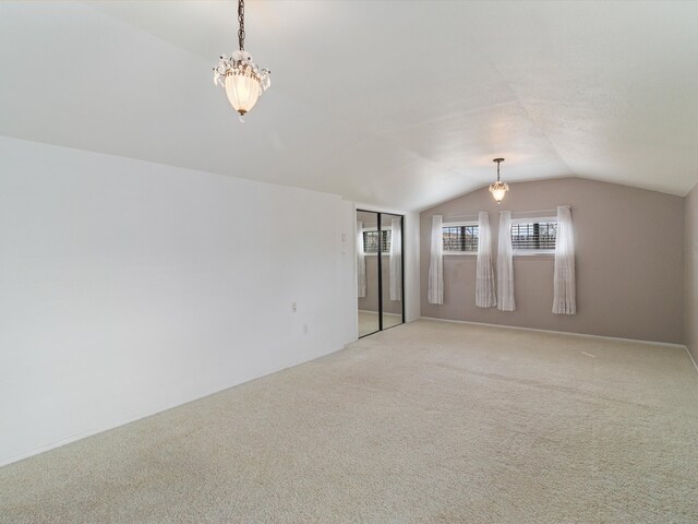 902 Calle Loma, Espanola, NM 87532 - empty room featuring vaulted ceiling and light carpet